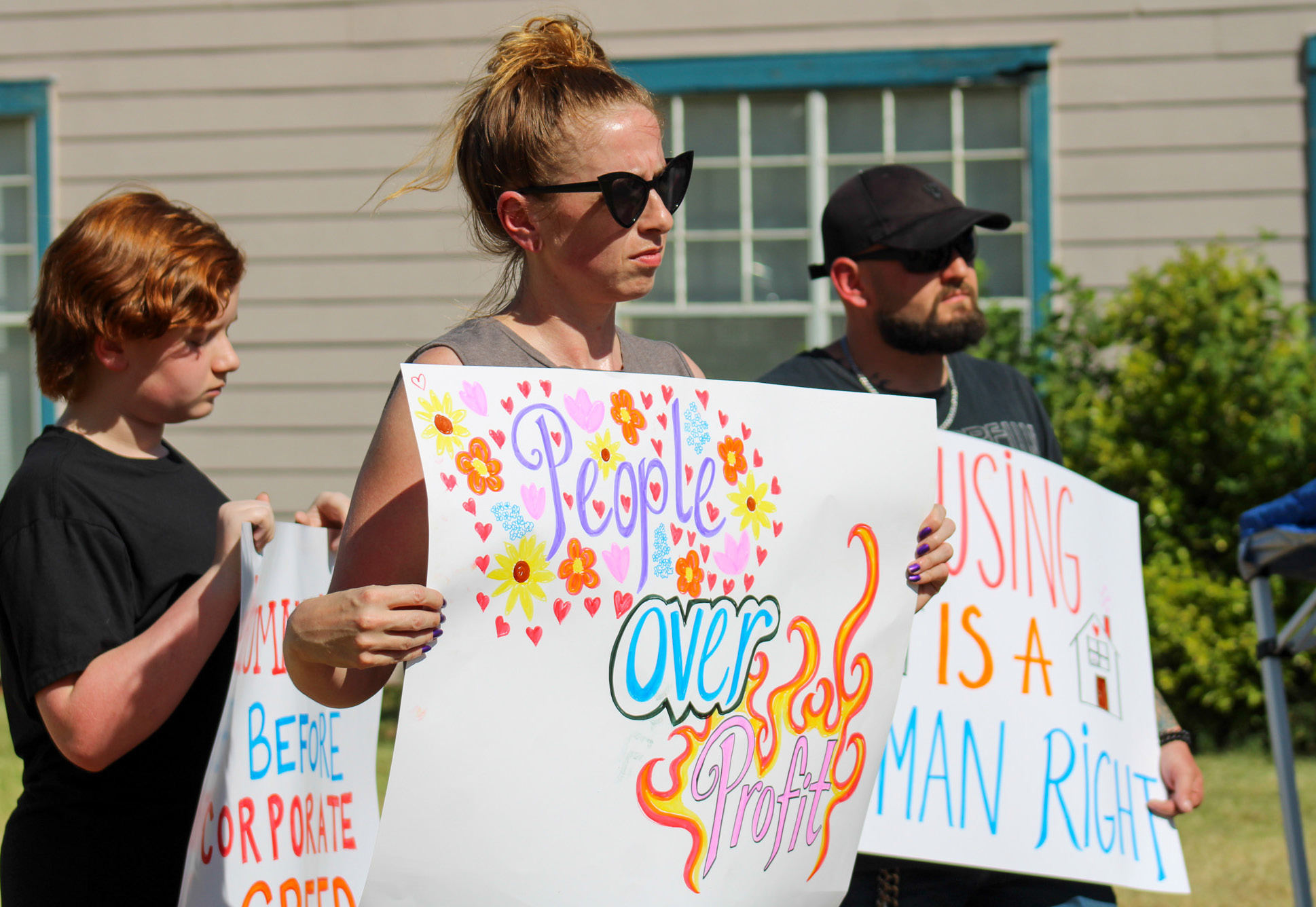 Community members organized a peaceful protest due to the recent evictions of residents at the 75-unit Madison Chase apartment complex Friday, July 10. ELIZABETH TANNER/THE GREENBELT INTREPID
