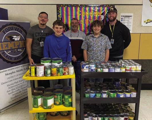 Memphis Middle School students and staff, including Memphis Middle School Principal Wes Hardin, science teacher and coach Jared Casas and geography and computer applications teacher and coach Kevin Alexander, donate canned goods to Hall County Home Delivered Meals. Memphis Meals on Wheels Director Tiniya Johnson accepted the donation of canned goods, which were collected during a canned food drive at Memphis Middle School. Photos Courtesy of Memphis ISD
