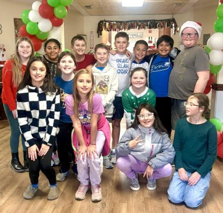 Childress Elementary School fourth-grade students spread holiday cheer at Childress Healthcare Center Thursday, Dec. 18, singing to and visiting with residents. Following the excursion, students traveled to Fair Park, where they enjoyed Christmas in the Park’s lighted displays. Childress Elementary School