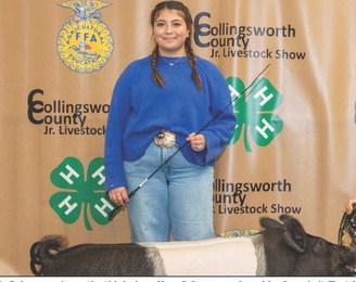 Bella Bohannon shows the third-place Cl_ Cooperative at the Premium Sale,