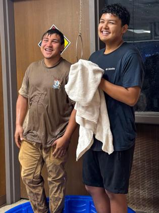 Memphis High School students test the water, pulling the shower in the science lab. MEMPHIS ISD