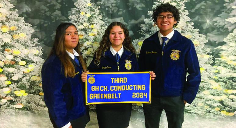 The Greenhand Chapter Conducting team of Yolanda Escovedo, Briel Casas and Richard Garcia receive their third-place banner at the Greenbelt District FFA District Banquet Monday, Dec. 9.