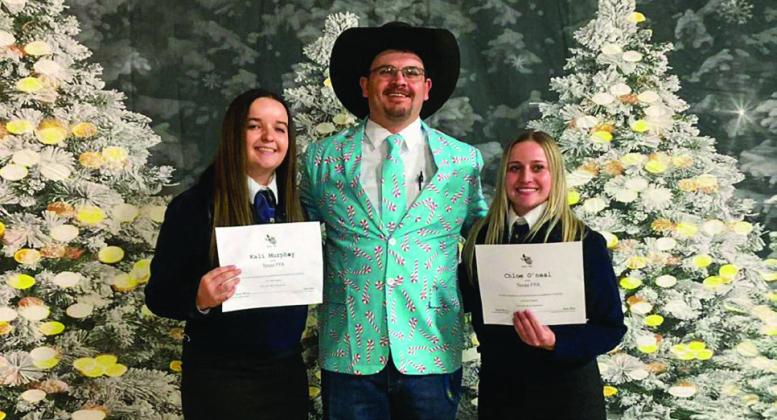 Kali Murphy, left, and Chloie O’Neal, right, receive a certificate for earning a State FFA Degree during the Greenbelt District FFA District Banquet Monday, Dec. 9.