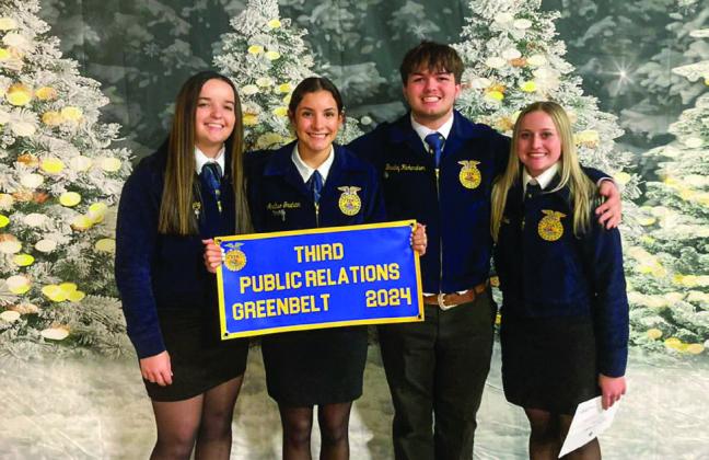 The Public Relations team of Kali Murphy, Analise Graham, Bradley Richardson and Chloie O’Neal receive their thirdplace banner at the Greenbelt District FFA District Banquet Monday, Dec. 9.