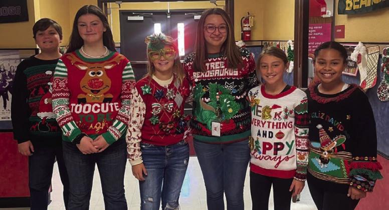 Cabbell, Peters claim Wellington Elementary ugly sweater contest prizes