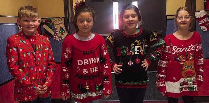 Cabbell, Peters claim Wellington Elementary ugly sweater contest prizes
