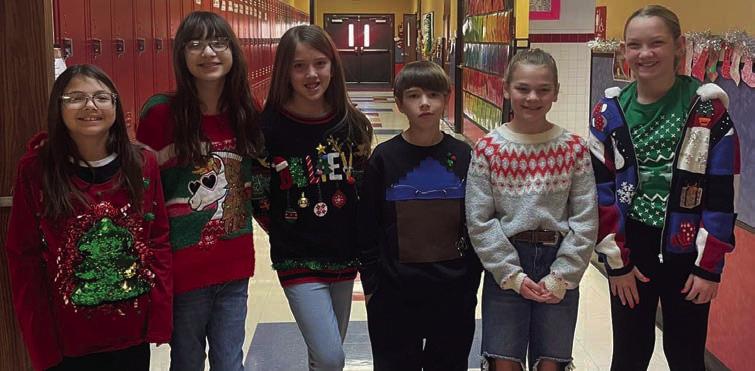 Cabbell, Peters claim Wellington Elementary ugly sweater contest prizes
