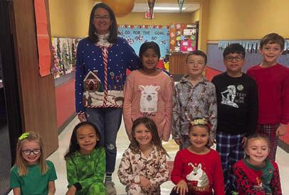 Cabbell, Peters claim Wellington Elementary ugly sweater contest prizes