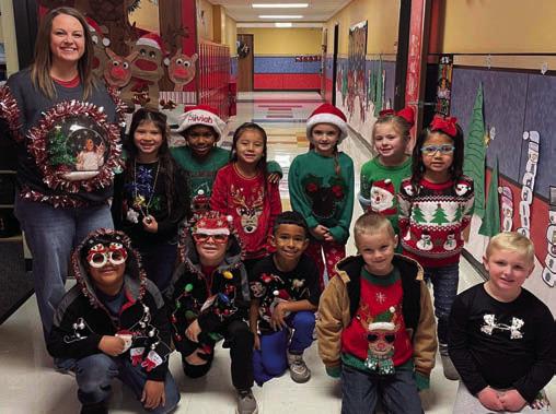 Cabbell, Peters claim Wellington Elementary ugly sweater contest prizes