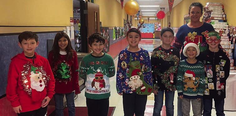 Cabbell, Peters claim Wellington Elementary ugly sweater contest prizes