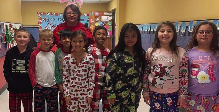Cabbell, Peters claim Wellington Elementary ugly sweater contest prizes
