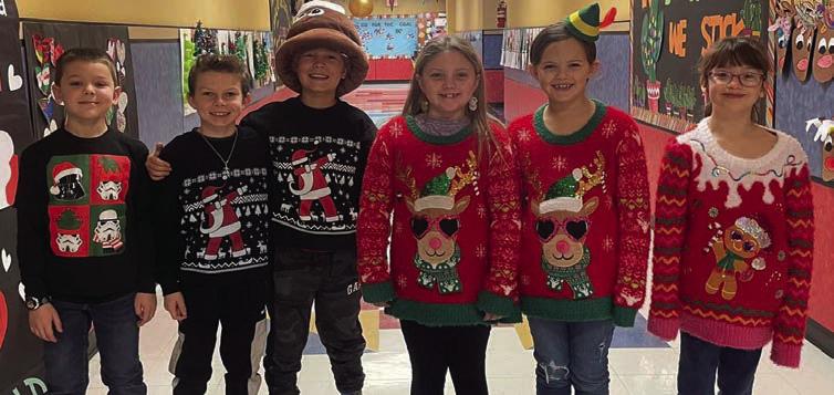 Cabbell, Peters claim Wellington Elementary ugly sweater contest prizes