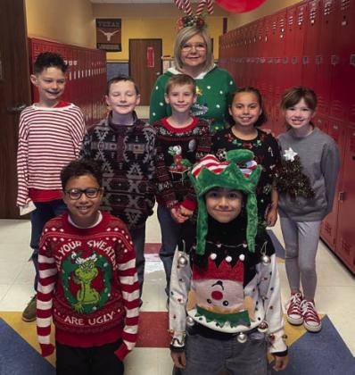 Cabbell, Peters claim Wellington Elementary ugly sweater contest prizes