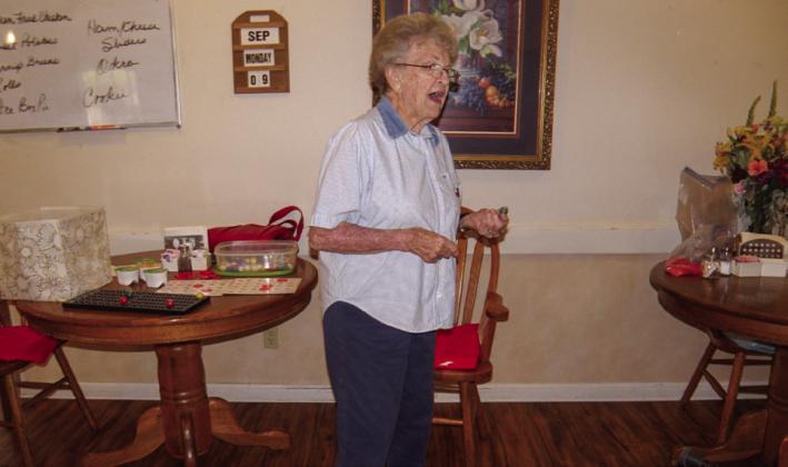 Anne Fromm calls bingo numbers at the weekly bingo session Monday, Sept. 9 at Cottage Village Assisted Living Facility in Childress. Players are joined by family and friends, with ample time between games for conversation. Photos by Grace Holman