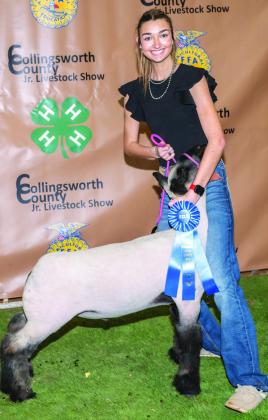 Gracie Lampe exhibits the firstplace Class 1 Lamb, purchased by Henard Farms at the Premium Sale.