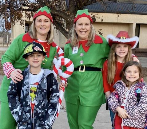 Santa, his helpers and the Grinch visit Childress Elementary