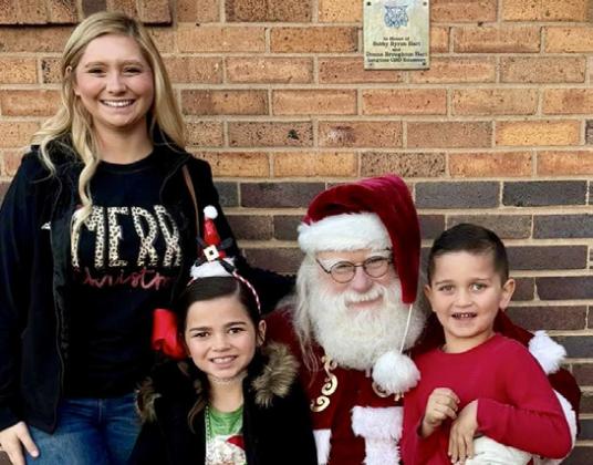 Santa, his helpers and the Grinch visit Childress Elementary