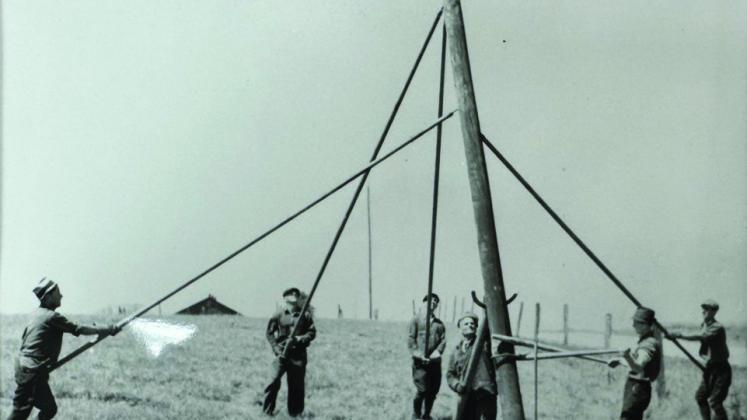 When Orvile Couch first started the electric co-op, experienced contractors had to be hired to build the line. “We would hire day labors and pay them $5 a day just to dig pole holes,” Greenbelt Electric Cooperative General Manager Randy White said. “We later purchased an auger that we drug around on a trailer to dig the holes but still had to set up the pole with these pole pikes.” Photo Courtesy of GEC