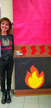 CHS teacher Wendi Stephens door features a fireplace, complete with hanging stockings.