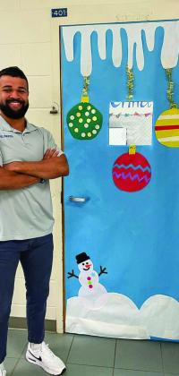 CHS teacher and coach Caleb Tucker’s classroom door features Christmas ornaments and a snowy backdrop.