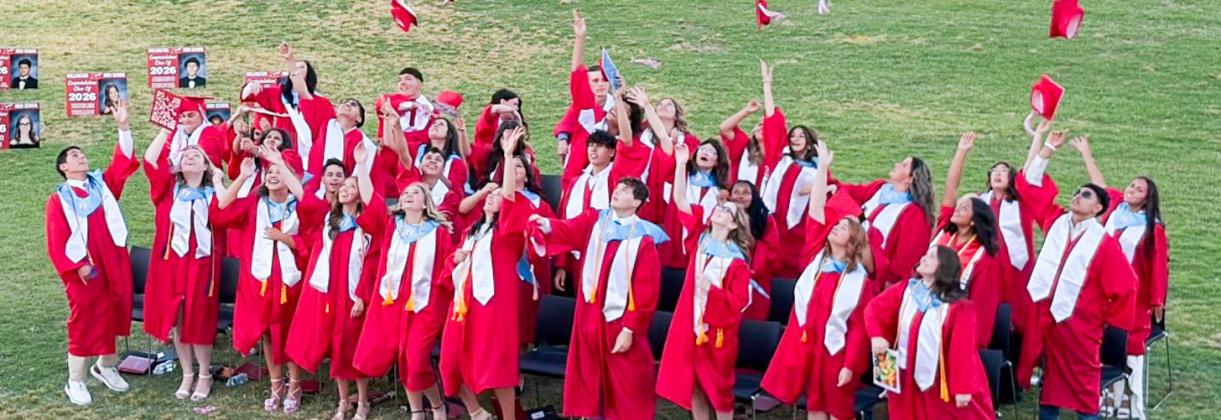 Marking the end of their high school journey, the Wellington Skyrocket Class of 2026 graduates toss their caps in celebration of receiving their diplomas following the 7 p.m. ceremony Friday, May 8 at Powell Field. BEV ODOM/THE GREENBELT INTREPID