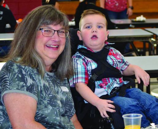 A Head Start student at Wellington Elementary School, Clive Downing’s grandmother, Rachel Downing, joins him in the cafeteria for the recent Grapes for Grandparents event. Clive’s main issue currently is chronic kidney disease. Courtesy Photo
