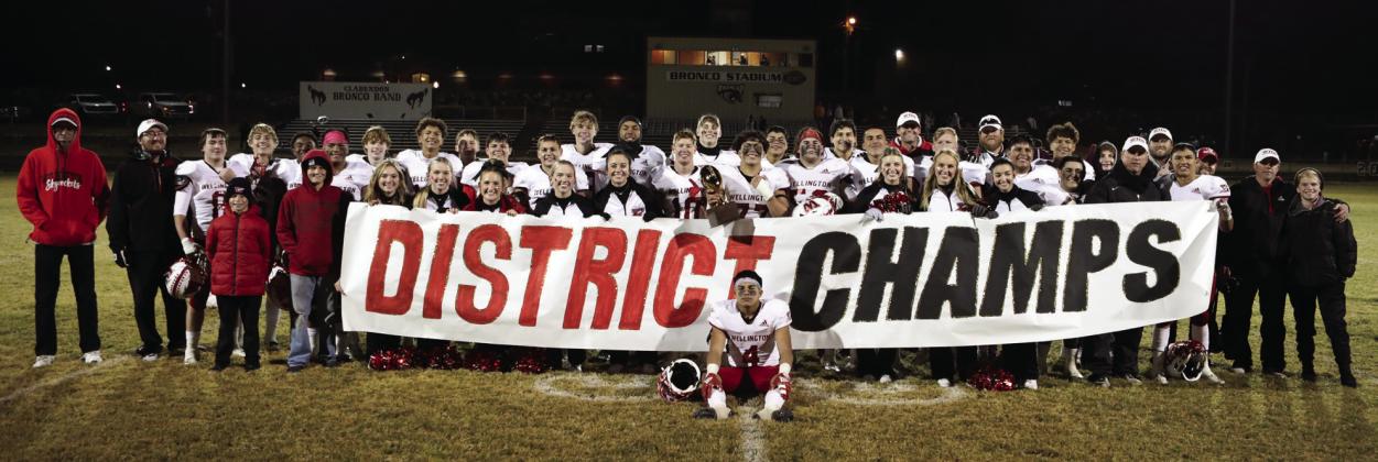 The Wellington Skyrockets display their District 2-2A Division II Championship trophy on a chilly Friday, Nov. 4 following a 44-8 win against the Clarendon Broncos. Lukas Wilbur Photography