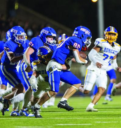 Bobcat wide receiver Cash Hightower attempts to make a touchdown run Friday, Sept. 20, as a Sunray defensive lineman stops the play. Holding Childress to 245 yards, Sunray relied heavily on defense, making four interceptions in a big second half.
