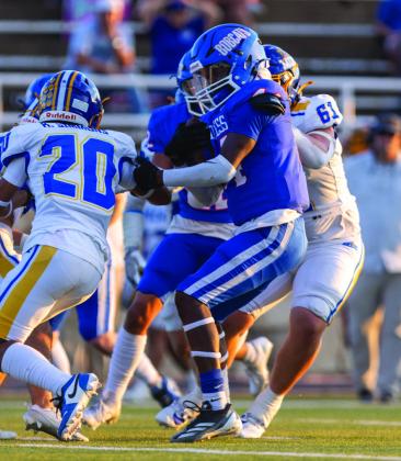 Childress’ Kobe Sims looks for yards against the Sunray Bobcats during a homecoming matchup Friday, Sept. 20 on Charlie Johnston Field at Fair Park Stadium in Childress. Childress, who held Sunray scoreless in the first half, took a 7-0 lead into the break, which was caught up by posthalf turnovers by Sunray.