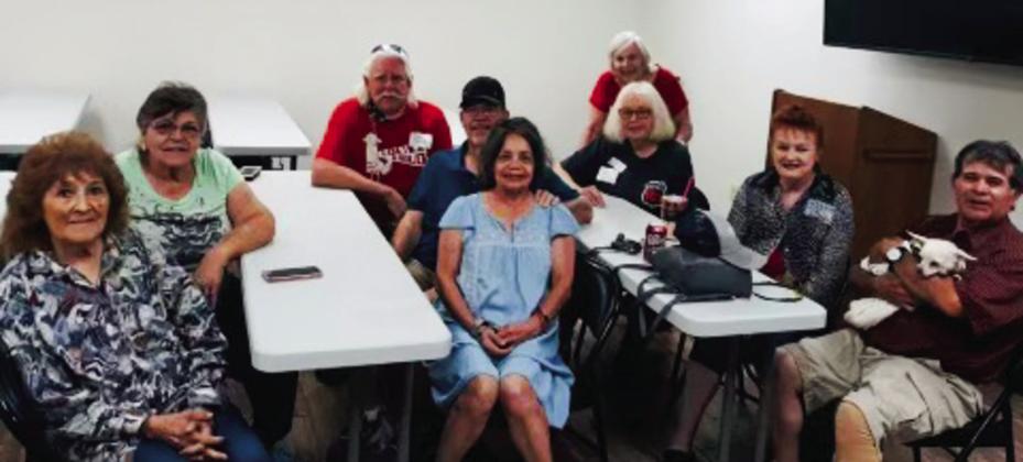 Guests Maria Ozuna, left, and Elva Ruiz Guajardo, Fred Peters, Wellington High School (WHS) Class of 1965, Lynn Fulcher, WHS Class of 1971, Linda Gonzales, WHS Class of 1971, Beth Peters Motsenbocker, WHS Class of 1971, LaJuanda Peters Ressel, WHS Class of 1967, guest Tonya Gonzales and Andy Gonzales, WHS Class of 1971, with Angel, gather at the Greenbelt Willie Room for fellowship and refreshments Friday, Aug. 5. See page 10A for additional WHS reunion photos. Courtesy Photos