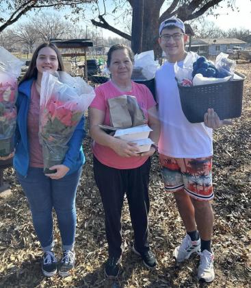 Youth gift Home Delivered Meal clients with Christmas joy