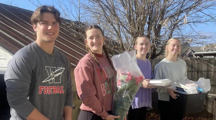 Youth gift Home Delivered Meal clients with Christmas joy