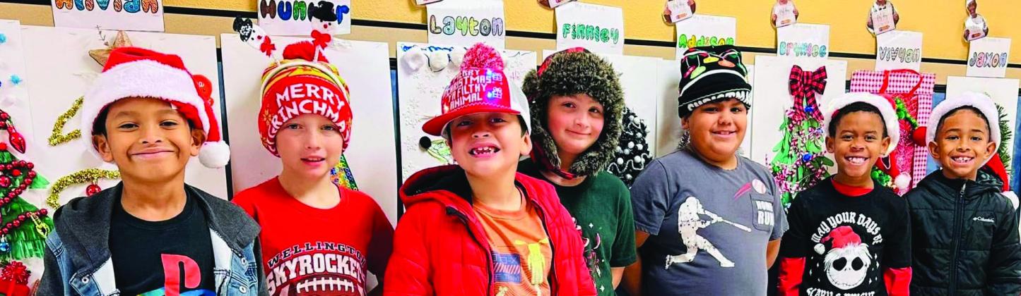 Wellington Elementary School students sport Christmas head gear