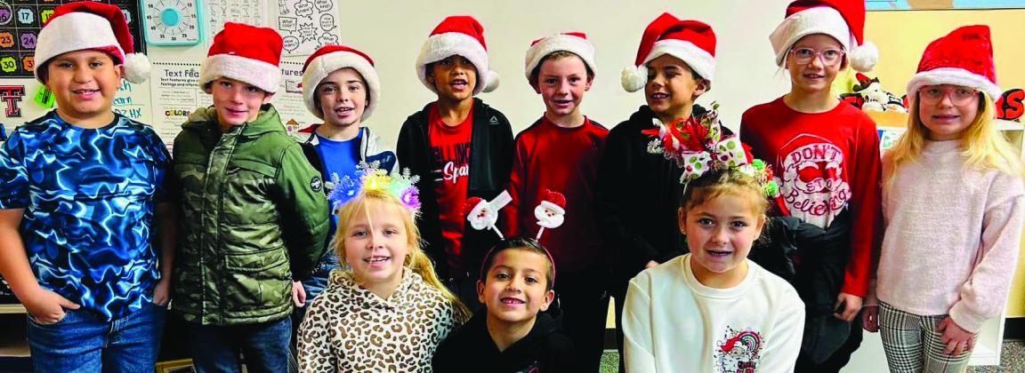 Wellington Elementary School students sport Christmas head gear