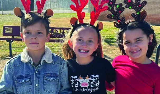 Wellington Elementary School students sport Christmas head gear