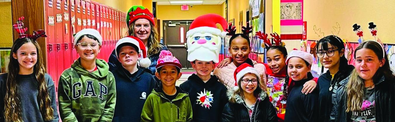 Wellington Elementary School students sport Christmas head gear