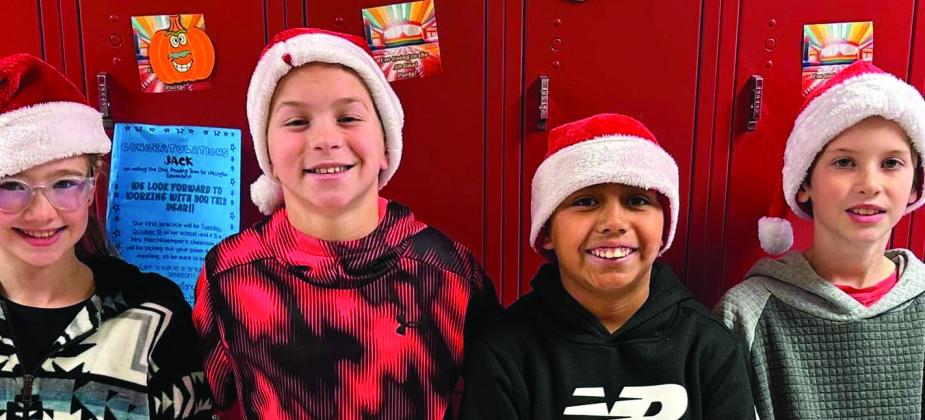 Wellington Elementary School students sport Christmas head gear