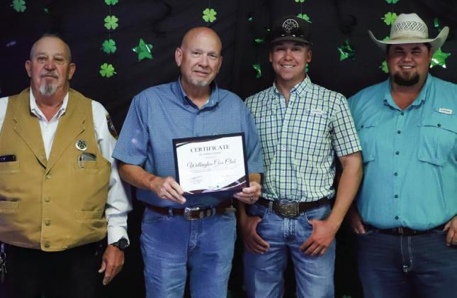 Members of Wellington Gun Club, including Kent Riley, left, Cliff Waller, Creed Waller and Kenny Patterson, accept one of multiple business 4-H supporter awards presented at the recent annual banquet. See page 4B for additional photos.
