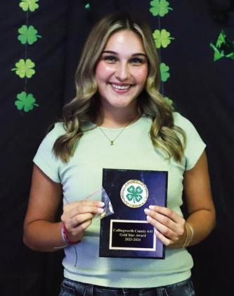 Emma Flores accepts the 2023-2024 Gold Star distinction.