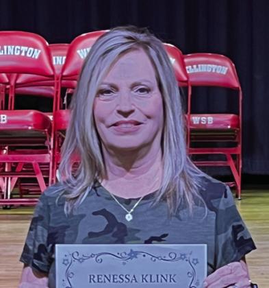 Retiree Renessa Klink accepts recognition upon her retirement for her years vested in Wellington Independent School District and the education system during the Friday, May 19 breakfast assembly at the Wellington High School Auditorium. Courtesy Photos