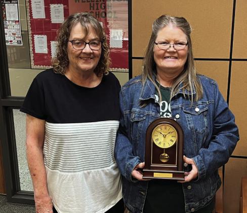Ranee Fourmentin, left, and Georgia Brown accept Pendulum Clocks in honor of their 30 years of service to Wellington Independent School District.