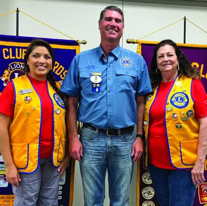 District 2-T1 Lions Governor Chris Rogers, center, presents special recognition pins to Wellington Lion and Zone Chairman Noemi Pena, left, and Boss Lion Margret Wood. Courtesy Photo