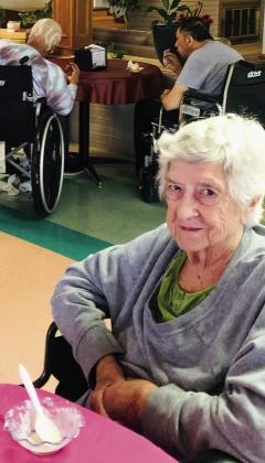 Georgia Thompson observes her birthday during a March birthday party at Wellington Care Center Thursday, March 30. Activity Director Dorothy Massey and staff served ice cream and treats to everyone. The Red River Sun/Bev Odom