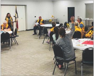 Lion Margret Wood describes upcoming events during the Monday, Sept. 4 meeting of the Wellington Lions Club back in the Club Room of the renovated Bura Handley Community Building. The Red River Sun/Bev Odom