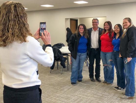Sen. Charles Perry Childress District Director Jennifer Foster snaps a photo at the Wellington town hall forum of Perry with Texas 4-H Water Ambassadors Brecklyn Powell, Jacy Lampe and Anna Granadoz and Mesquite Groundwater Conservation District General Manager Whitney Wiebe. The Red River Sun/Bev Odom
