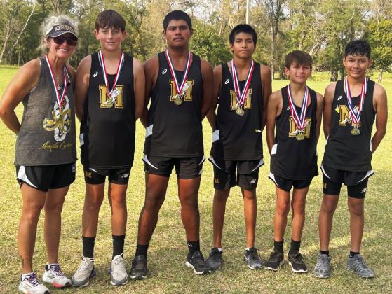 The Memphis Junior High Whirlwinds take the district championship title Wednesday, Oct. 9 in Wheeler. From left: Coach Michelle Branigan; Hutch Ollinger, 12th; Evin Zuniga, 9th; Demitri Sanchez, fourth; Aidan Hoffine, first; Julian Rodriguez, second.