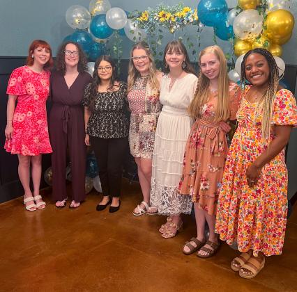 Wedding attendants and friends surround honoree Grace Kiker at her bridal shower on Saturday morning, June 7 at the downtown Wellington Lewis Building. From left: Victoria Kiker, Jalee Davis, Victoria Sanchez, Megan Manning, guest of honor Grace Kiker, Sarah Chadwick and Kira Mickens.