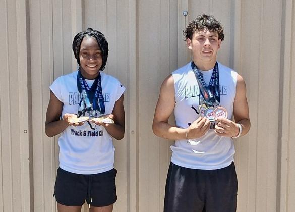 Texas Panhandle Track and Field Club’s Aija Johnson and Juno Castillo show off their hardware at the RUN West Texas track and field meet Saturday, June 14 at River Road High School in Amarillo.