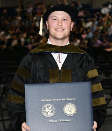 Cory Bodine, of Quanah, accepts his Doctor of Pharmacy Degree from Southwestern Oklahoma State University.