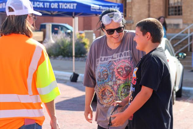 Childress County Heritage Museum Director Niki Seal, along with son Korben, undergoes a field sobriety test while wearing Fatal Vision goggles, which simulate the effects of alcohol impairment, during Childress County Heritage Museum and the Childress District of the Texas Department of Transportation’s Saturdays at the Museum event Saturday, July 26.
